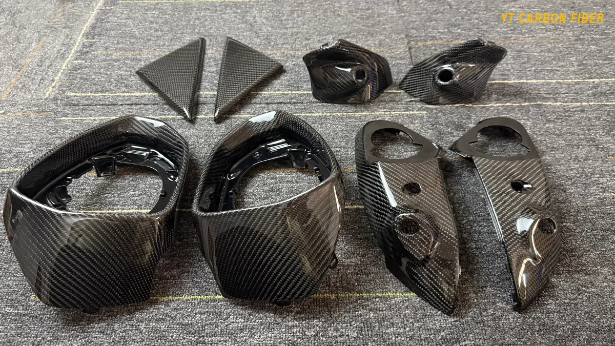 Carbon fiber automotive body panel weight reduction
