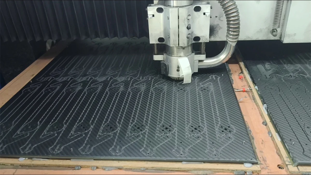CNC machine cutting carbon fiber sheet