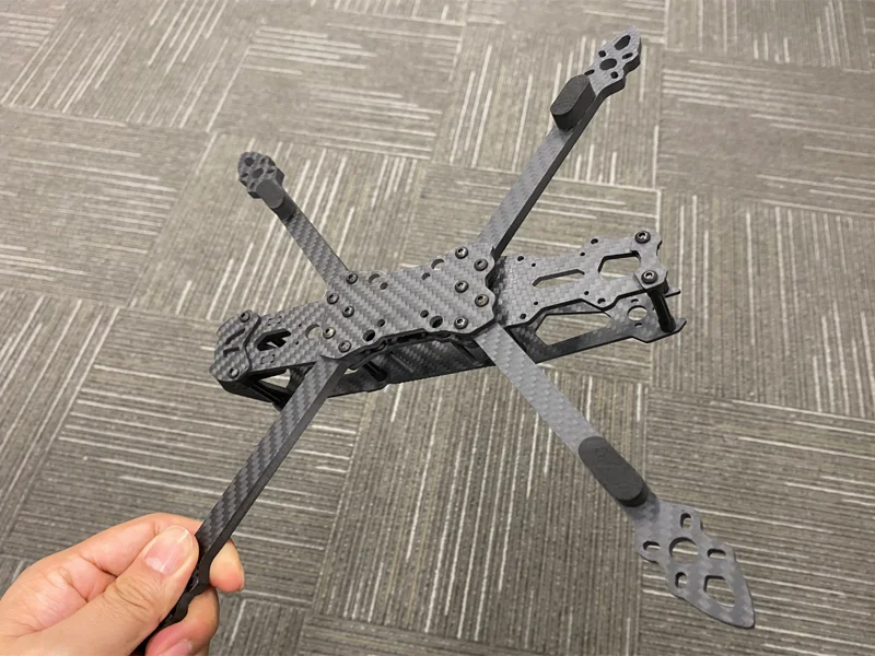 Carbon fiber FPV frame in flight showing lightweight performance advantage