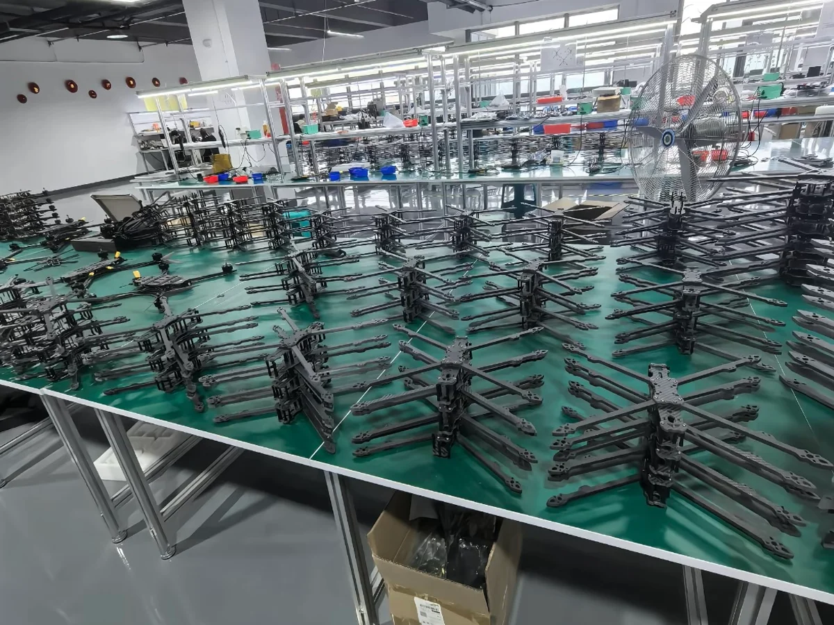 Carbon fiber drone frame in flight built with YTCarbon parts