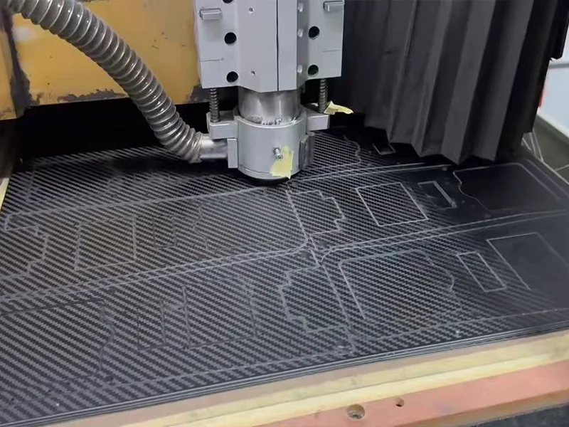 CNC router cutting carbon fiber sheet with precision tool path and minimal dust