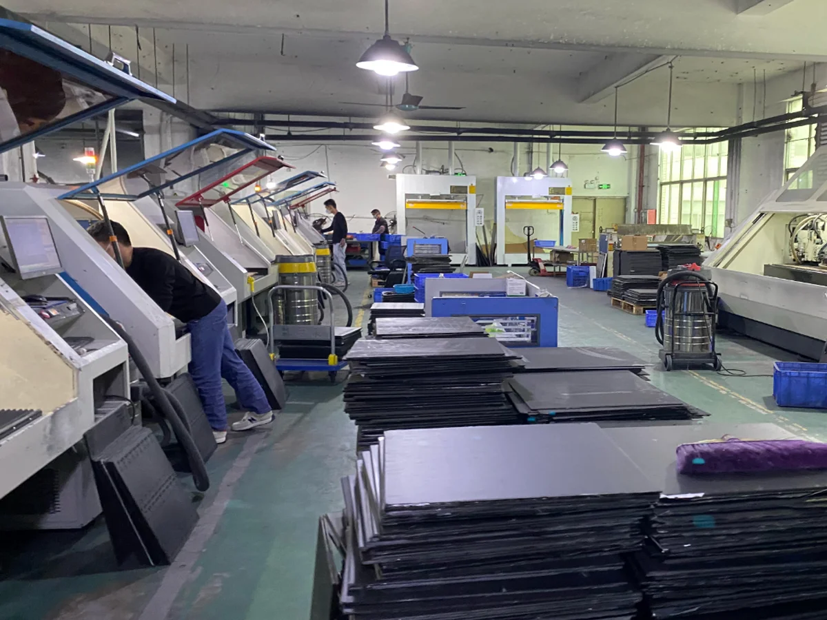 CNC machining center cutting carbon fiber parts at YTCarbon factory