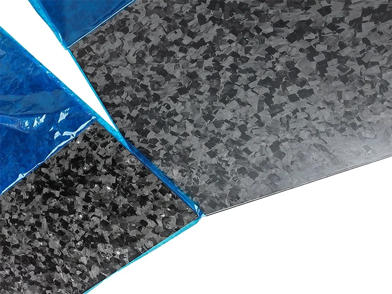 Close up of forged carbon fiber sheet showing unique marbled pattern and random fiber orientation