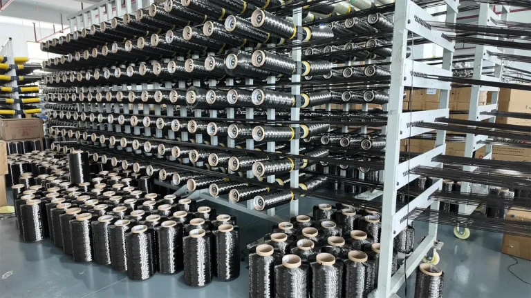 T1100 carbon fiber mass production hero image showing high-strength fiber tow