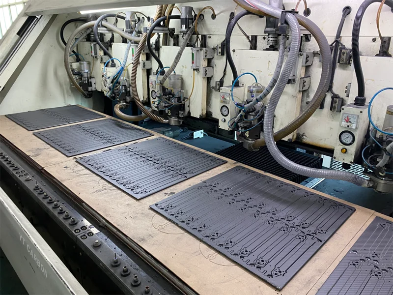 CNC machining center cutting carbon fiber drone frame parts at YTCarbon