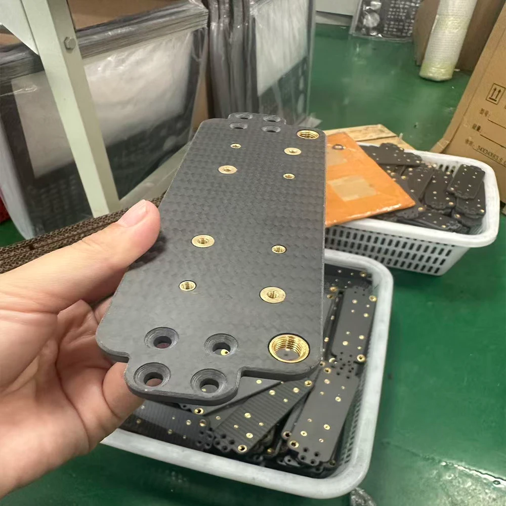 Carbon fiber plate with threaded inserts side view showing plate thickness and insert embedment depth