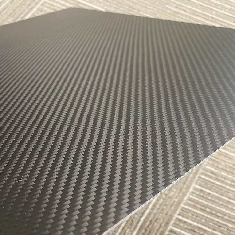 Close-up edge view of 3mm carbon fiber plate showing balanced plies