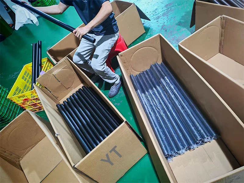 2,000 1.5m carbon fiber tubes with 80mm inner diameter being packed for shipment to Germany at YTCarbon