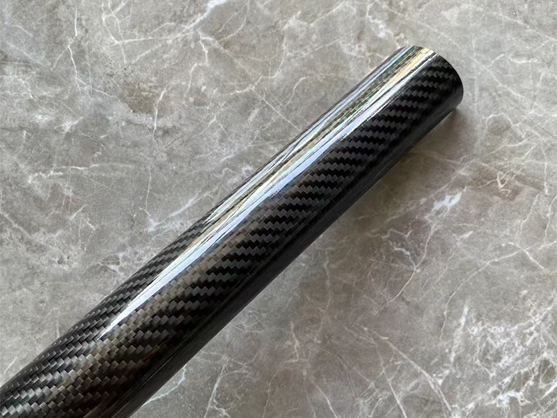 High-gloss finish 3K carbon fiber round tube prepared for custom interior design at YTCarbon Shenzhen factory